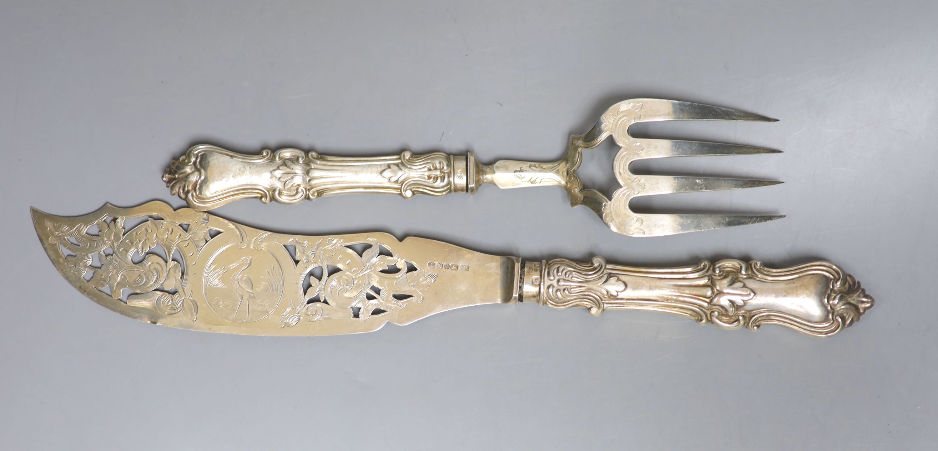 A pair of Victorian silver fish servers, Thomas Sansom, Sheffield, 1852, knife 33.5cm, loaded handles.